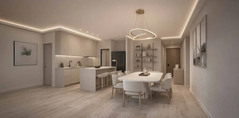 Cocina y comedor integrados del apartamento modelo de PH Omar Park View